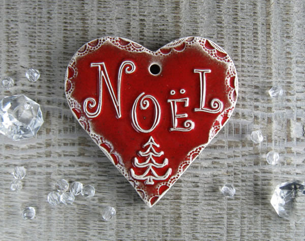 image avec un coeur et écrit Noël à l'intérieur