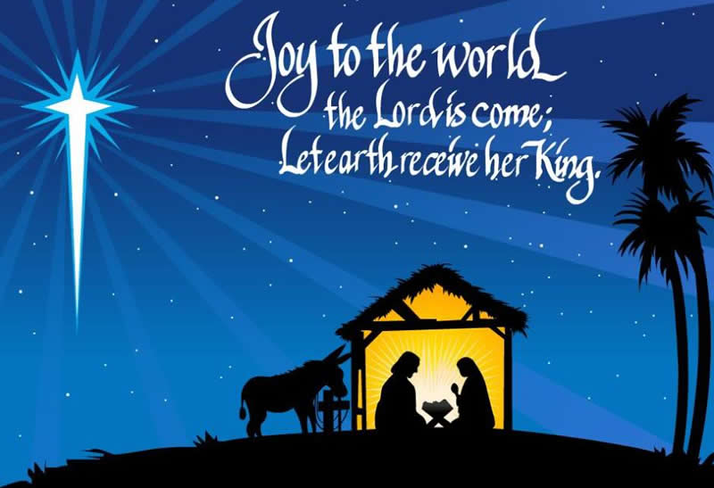 Image avec la crèche avec Giuseppe, Maria et l'âne avec une phrase de bons voeux en anglais: Joy to the world the Lord come; Let earth receive her King.